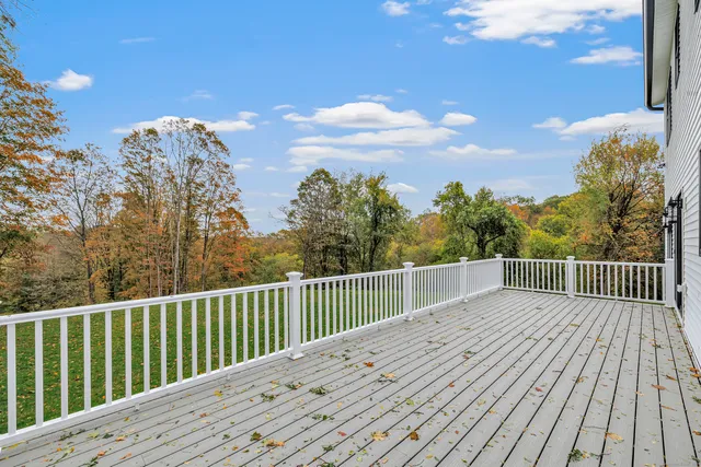 a view of a balcony with wooden floor