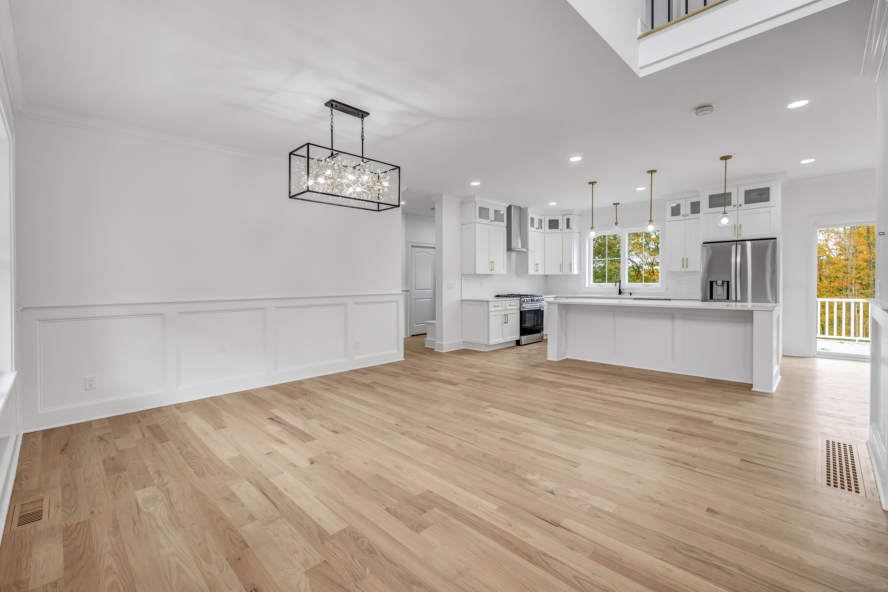 128 Barn Hill Road Monroe, CT 06468 - Photo 4 of 40 a view of a kitchen with wooden floor and a sink