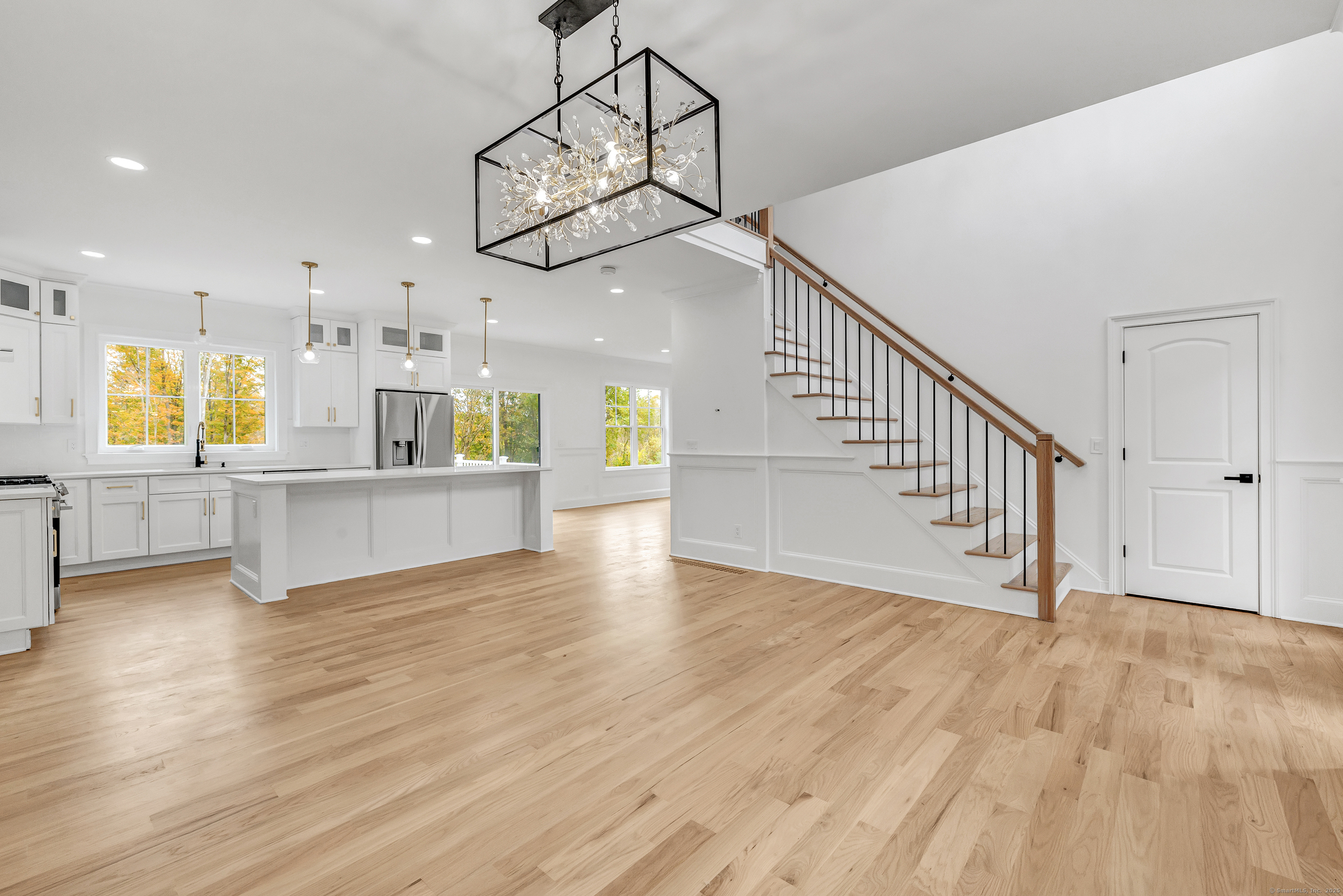 128 Barn Hill Road Monroe, CT 06468 - Photo 6 of 40 a view of a kitchen with wooden floor and a sink