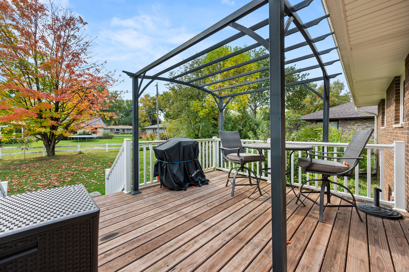 224 Dunkery Drive Sycamore, IL 60178 - Photo 13 of 39 a view of a deck with wooden floor and outdoor seating