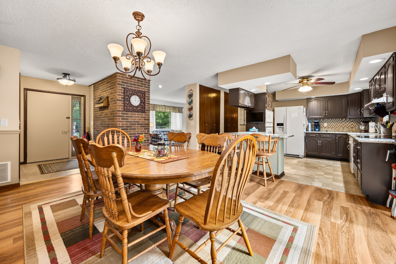 224 Dunkery Drive Sycamore, IL 60178 - Photo 17 of 39 a view of a dining room with furniture and a chandelier