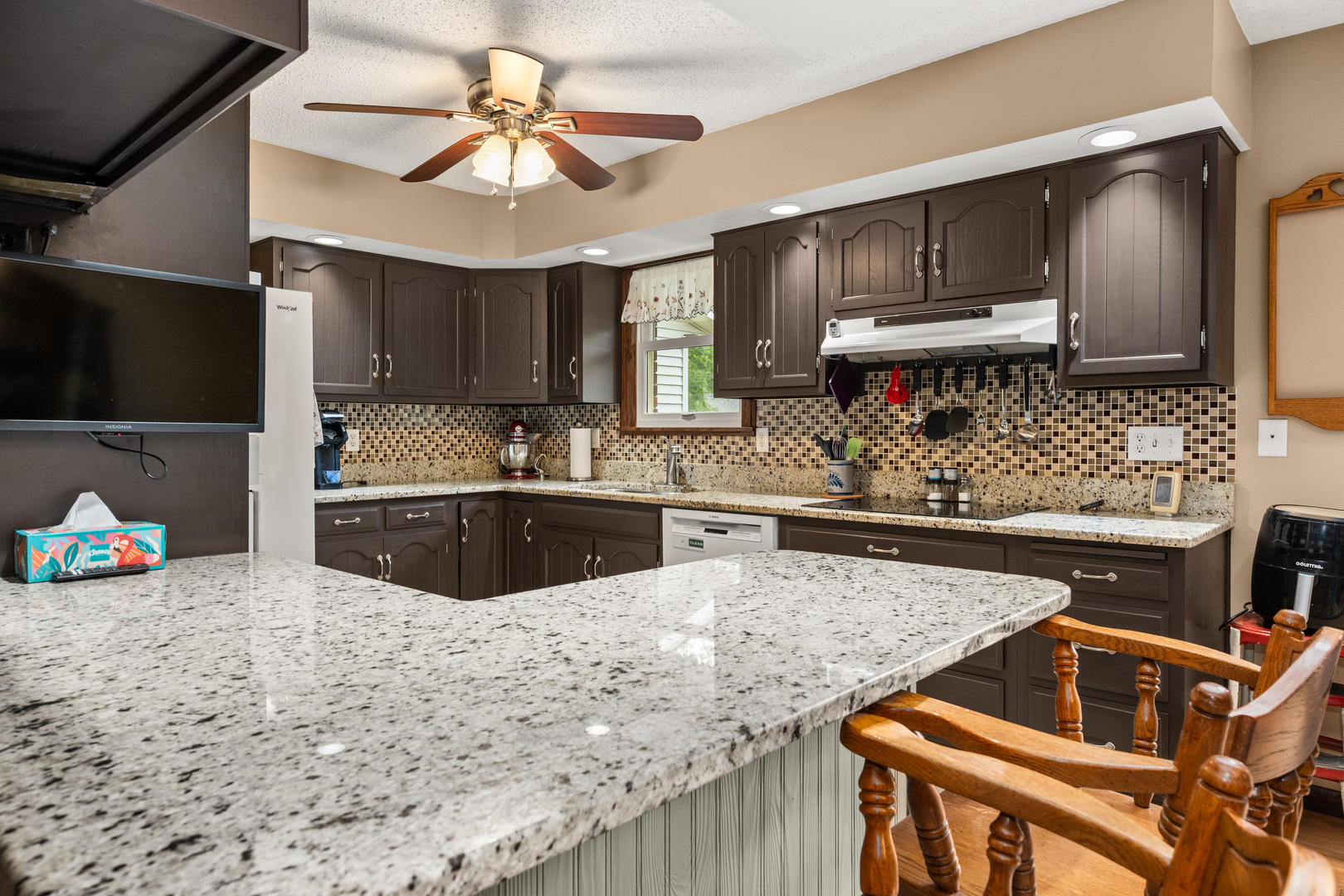 224 Dunkery Drive Sycamore, IL 60178 - Photo 19 of 39 a kitchen with stainless steel appliances granite countertop a sink stove and cabinets