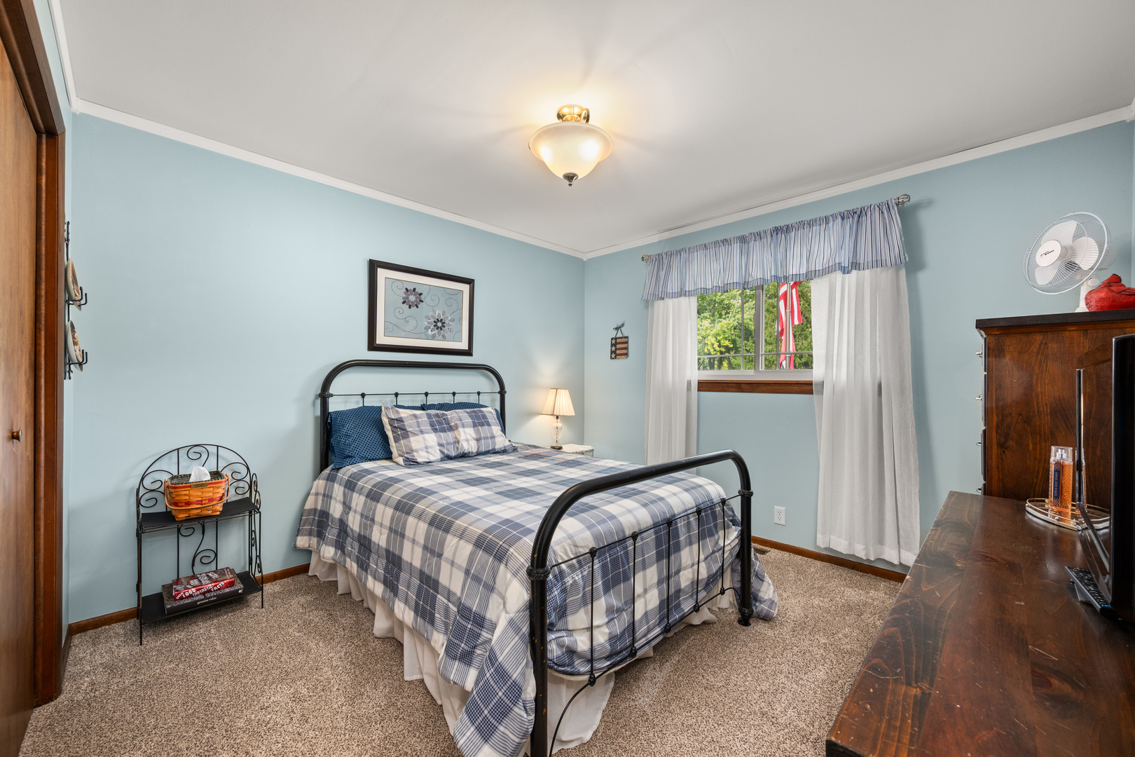 224 Dunkery Drive Sycamore, IL 60178 - Photo 25 of 39 a bedroom with a bed and a chandelier