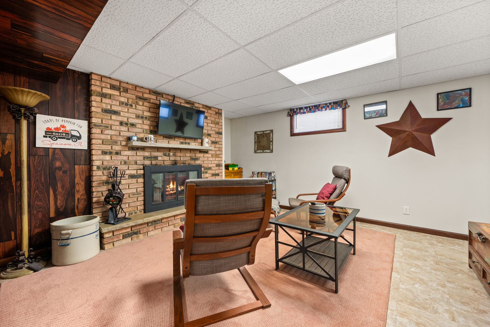 224 Dunkery Drive Sycamore, IL 60178 - Photo 30 of 39 a living room with furniture a flat screen tv and kitchen view