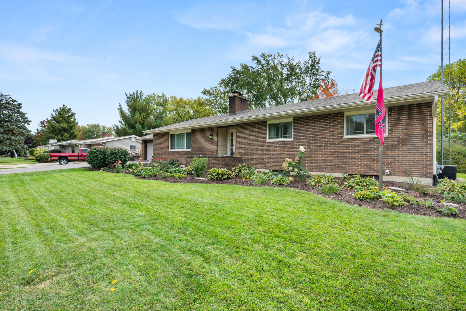 224 Dunkery Drive Sycamore, IL 60178 - Photo 3 of 39 a front view of a house with a garden