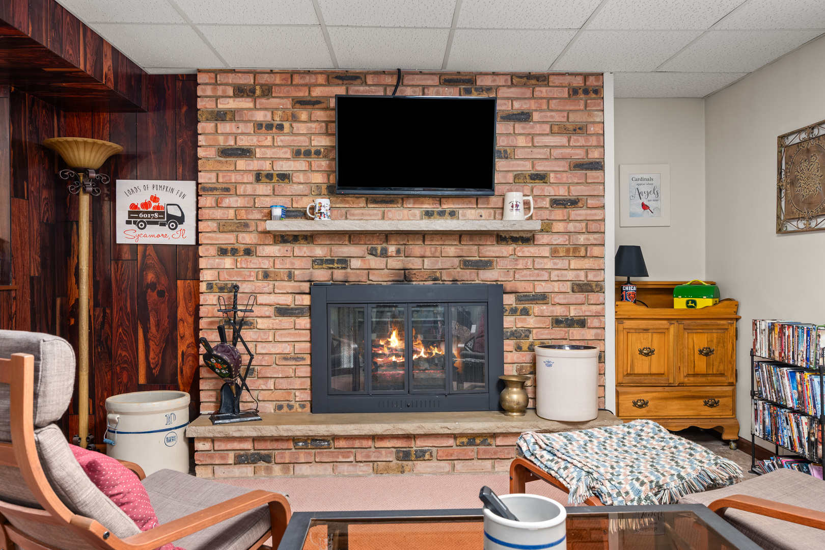224 Dunkery Drive Sycamore, IL 60178 - Photo 32 of 39 a living room with fireplace and a fireplace