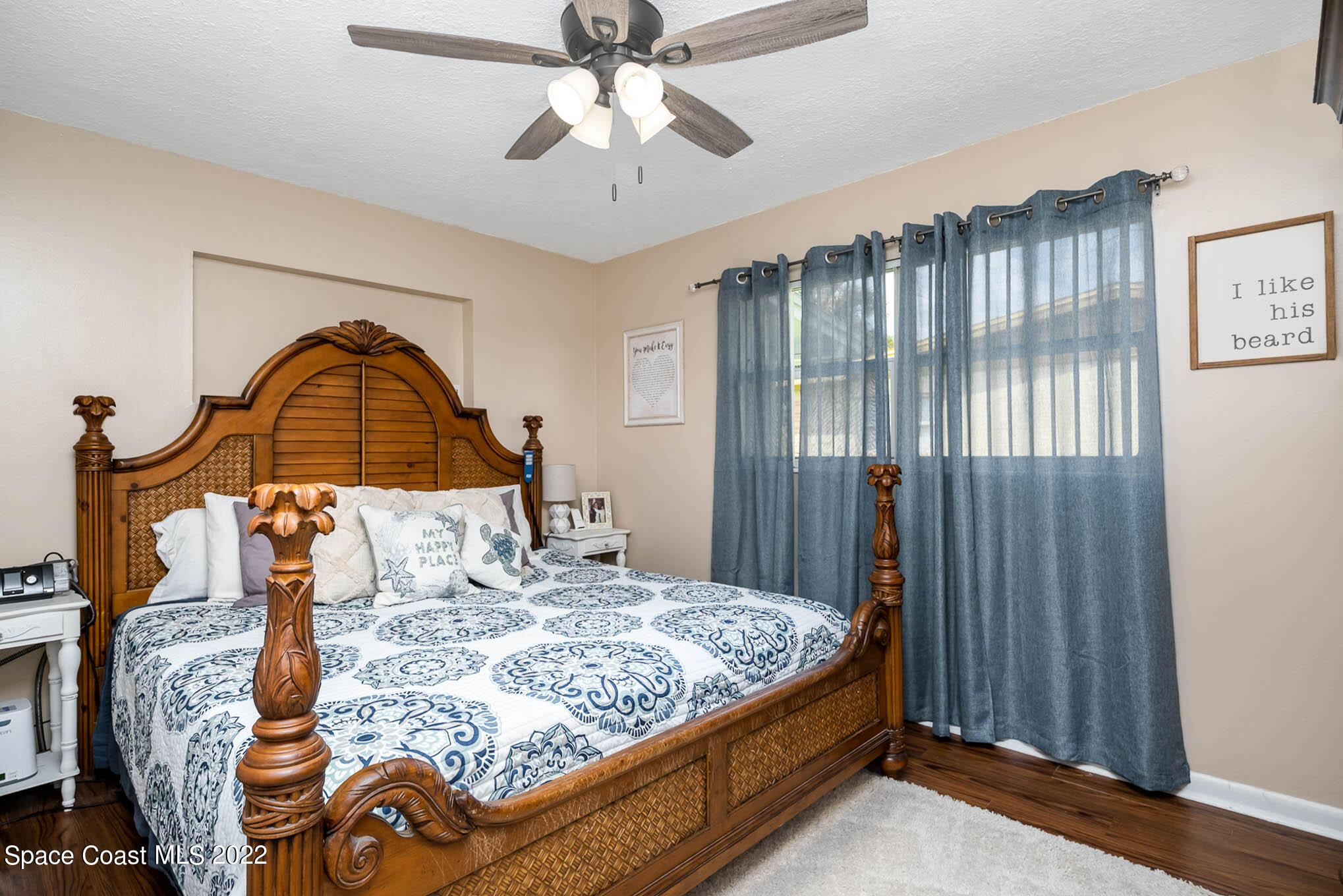 1080 Madrid Road Rockledge, FL 32955 - Photo 10 of 21 a bedroom with a bed and a chandelier