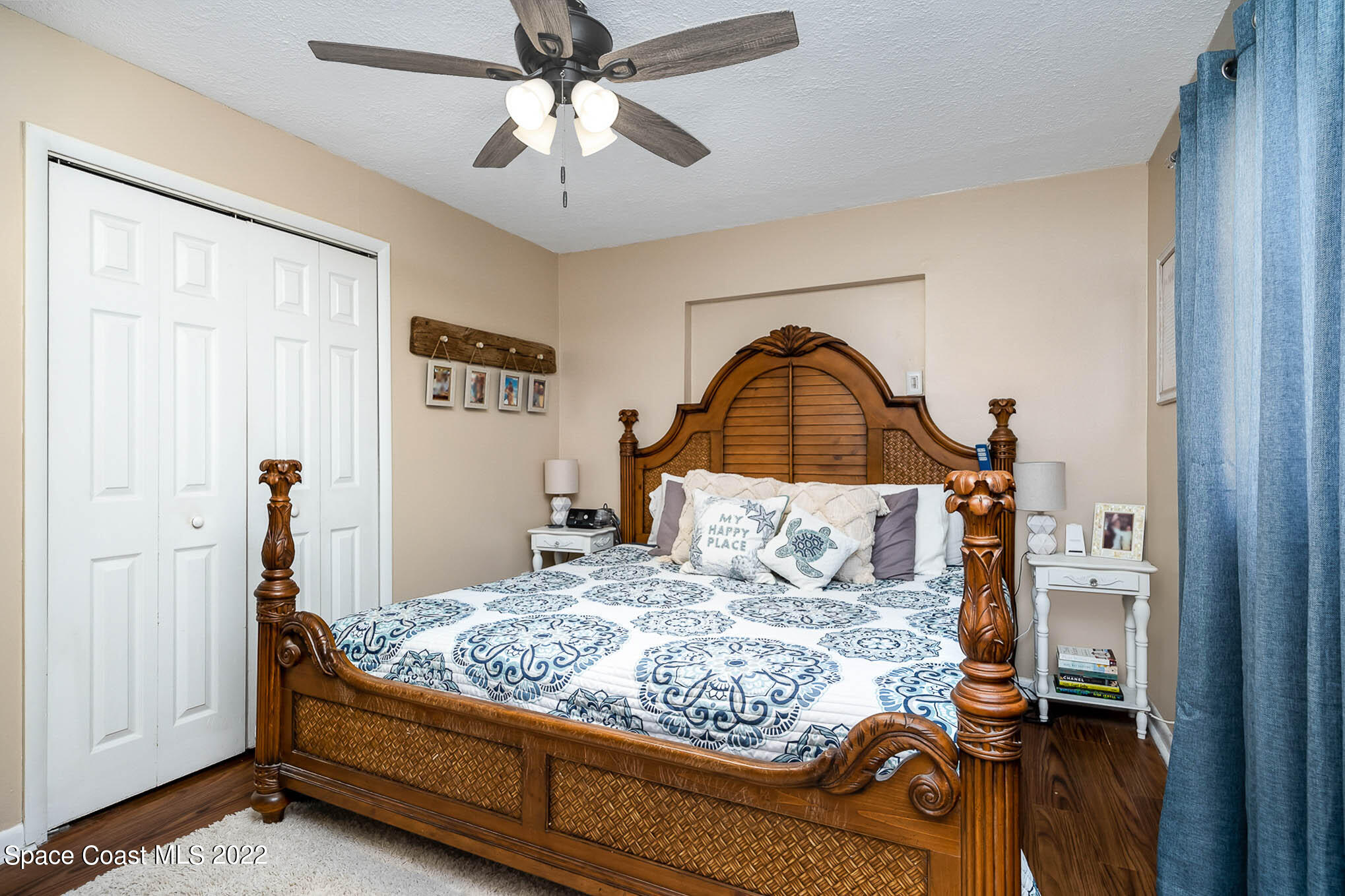 1080 Madrid Road Rockledge, FL 32955 - Photo 11 of 21 a bedroom with a bed and a chandelier