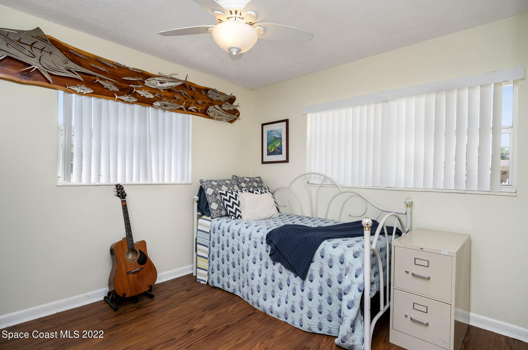 1080 Madrid Road Rockledge, FL 32955 - Photo 14 of 21 a bedroom with a bed and wooden floor