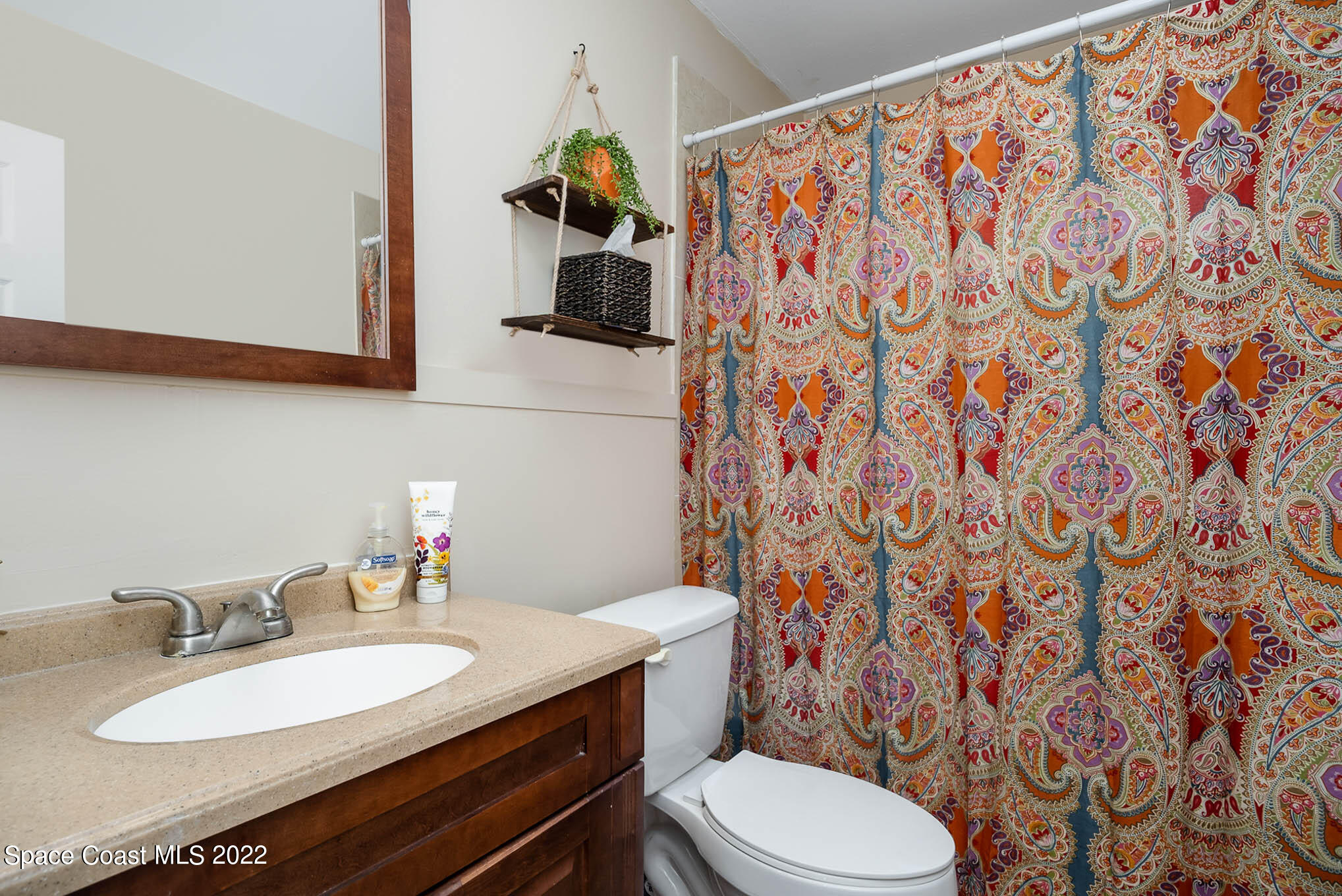 1080 Madrid Road Rockledge, FL 32955 - Photo 15 of 21 a bathroom with a granite countertop sink and a mirror
