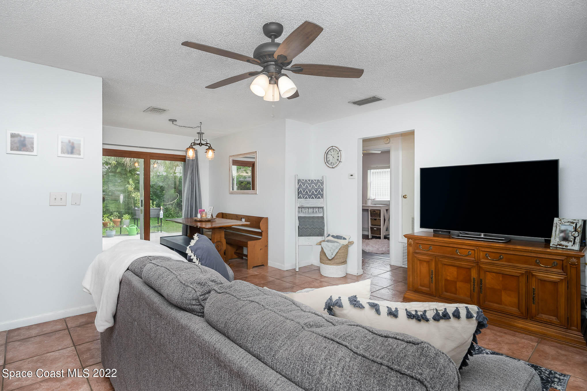 1080 Madrid Road Rockledge, FL 32955 - Photo 21 of 21 a living room with furniture and a flat screen tv
