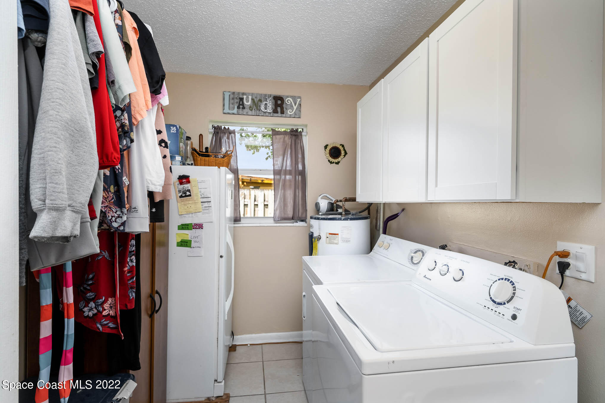 1080 Madrid Road Rockledge, FL 32955 - Photo 9 of 21 a view of walk in closet with clothes and shoes