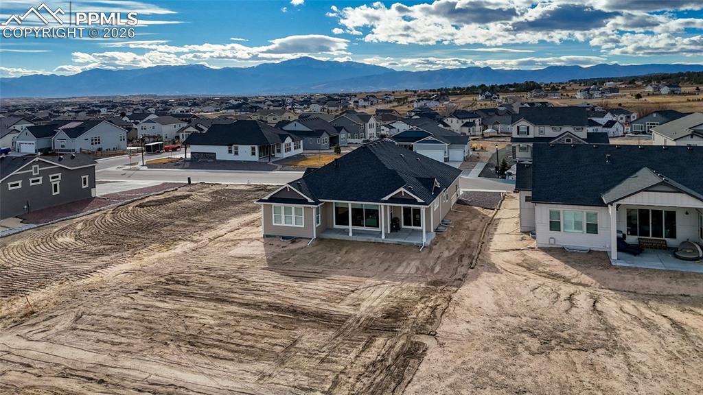 10059 Owl Perch Loop Colorado Springs, CO 80908 - Photo 5 of 50 Aerial perspective of suburban area with a mountain backdrop