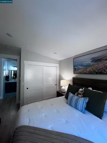 a bed room with a bed and a television