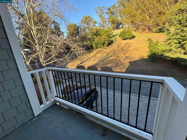 a view of balcony with wooden floor