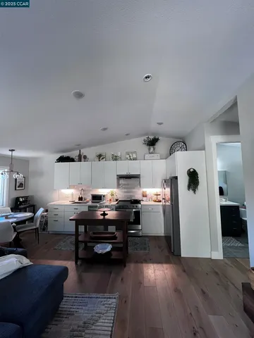 a view of kitchen and kitchen with furniture