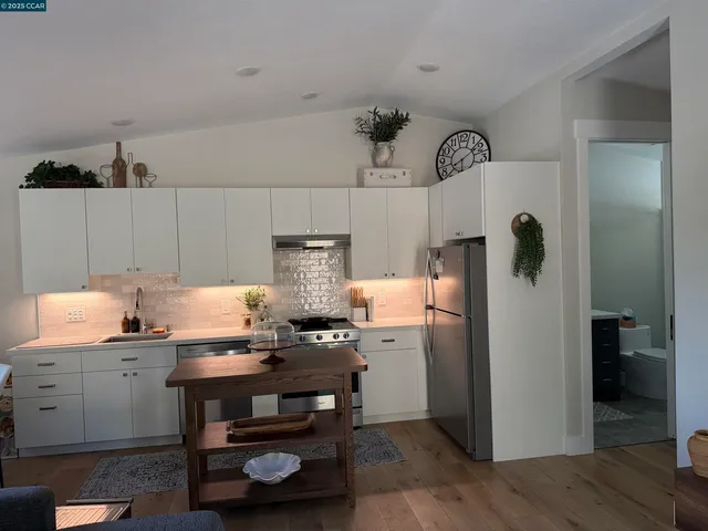 a kitchen with sink cabinets and window