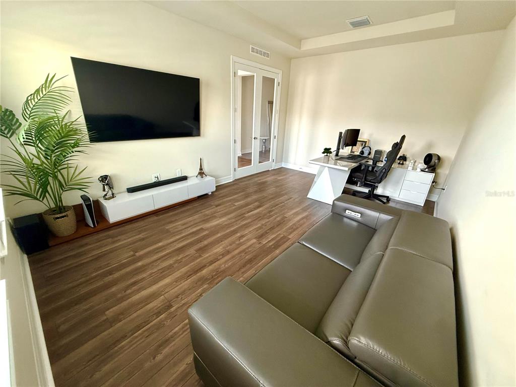 8441 Pk Clf Way Orlando, FL 32836 - Photo 5 of 59 a living room with furniture and a flat screen tv