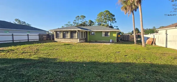 a view of a house with a big yard