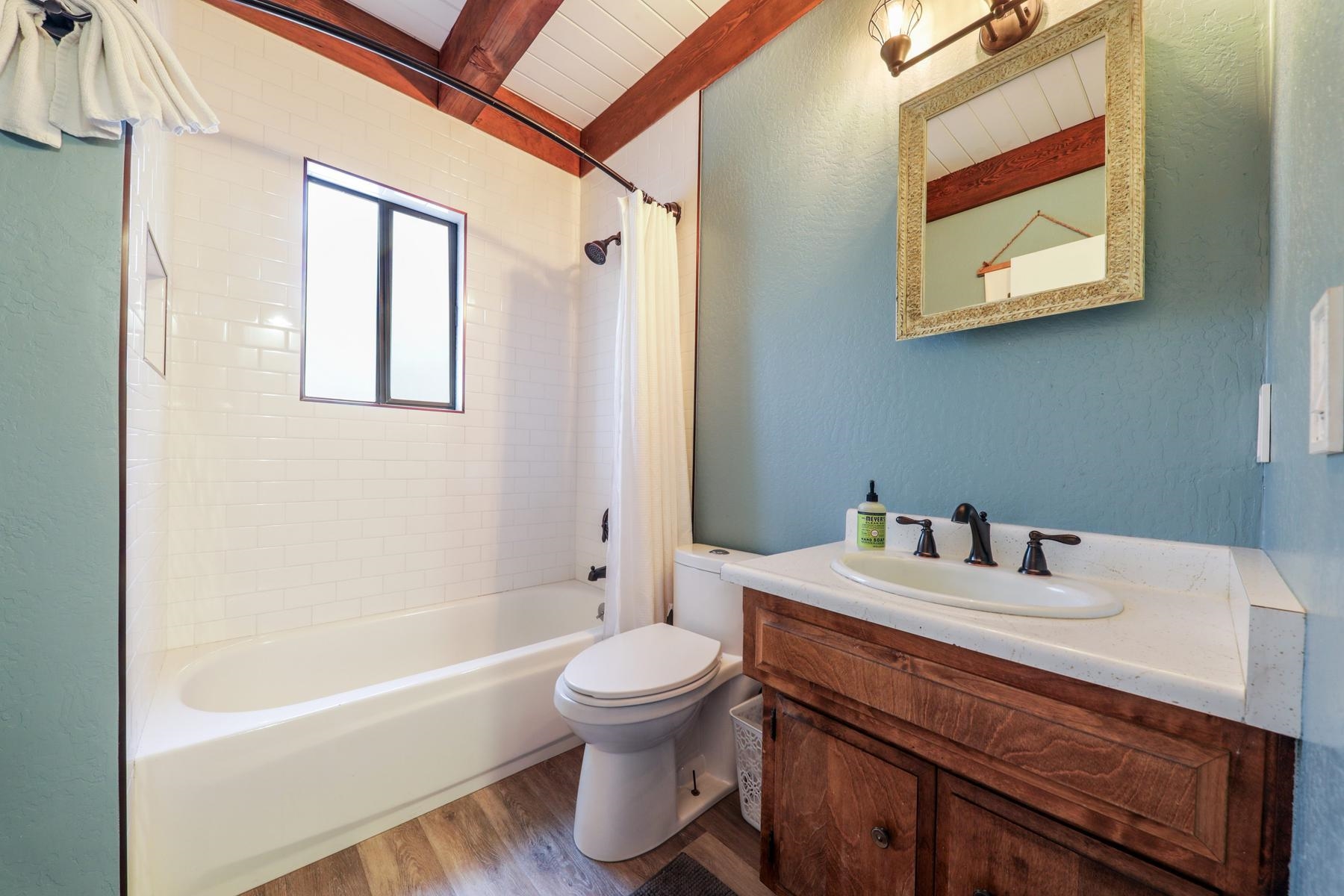 5656 Victoria Road Carnelian Bay, CA 96140 - Photo 19 of 28 a bathroom with a sink a toilet and a bathtub