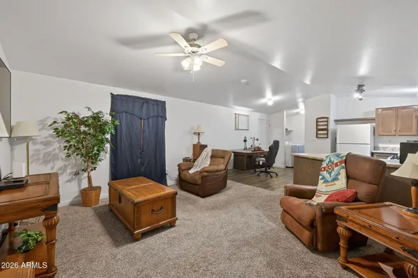 a living room with furniture and a chandelier