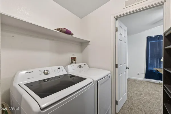 a utility room with dryer and washer