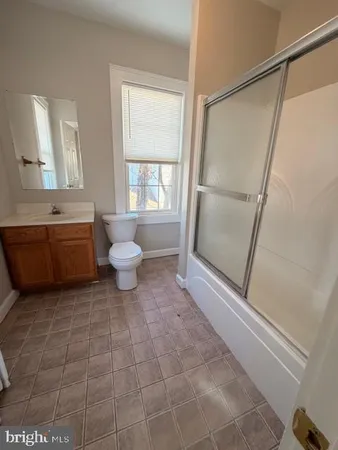 a bathroom with a sink a toilet and a bathtub