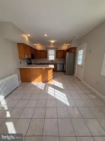 a kitchen with stainless steel appliances a refrigerator and a sink