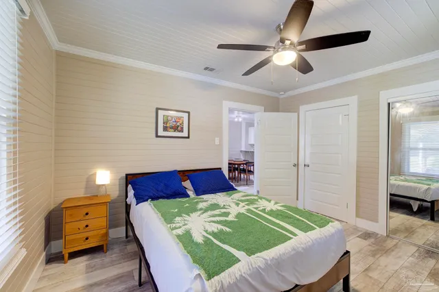 a bed room with a bed and a window