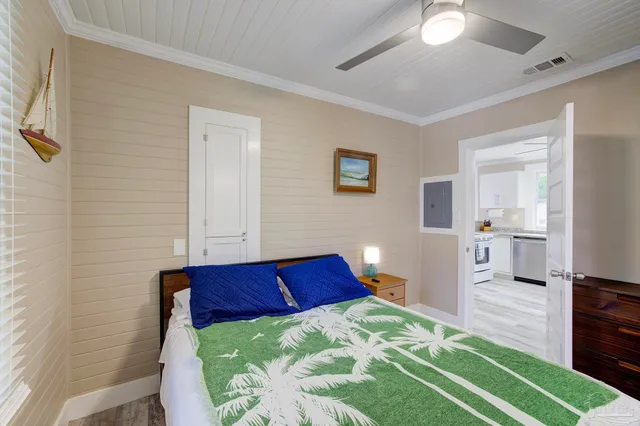 a bedroom with a bed and a view mirror