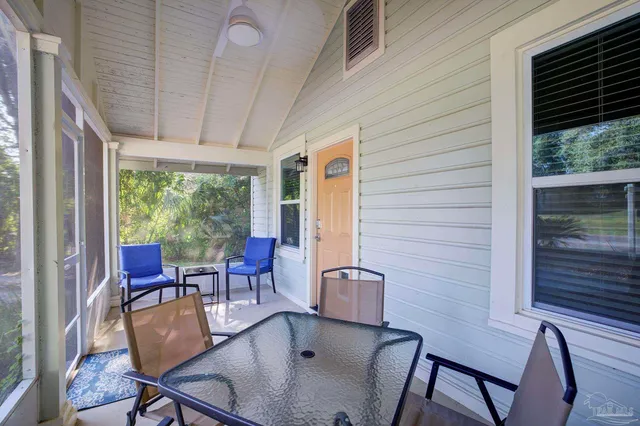 a dining room with furniture window and outside view