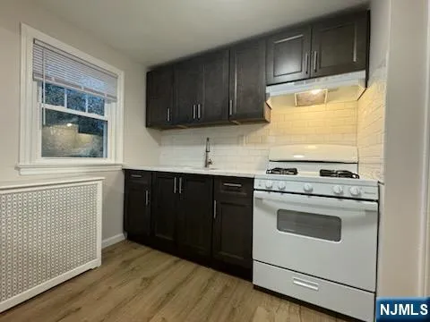 a kitchen with a stove and a microwave