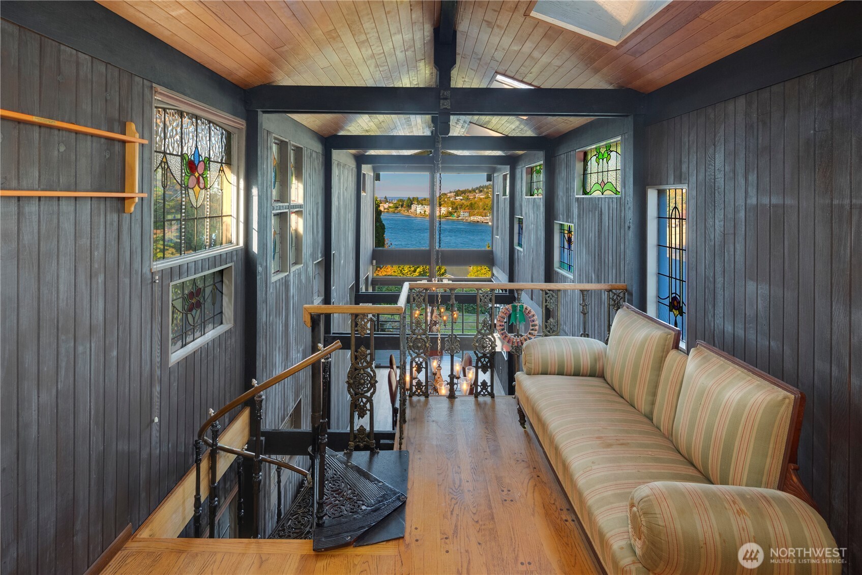 3653 West Commodore Way Seattle, WA 98199 - Photo 13 of 35 a living room with furniture two large windows and wooden floor