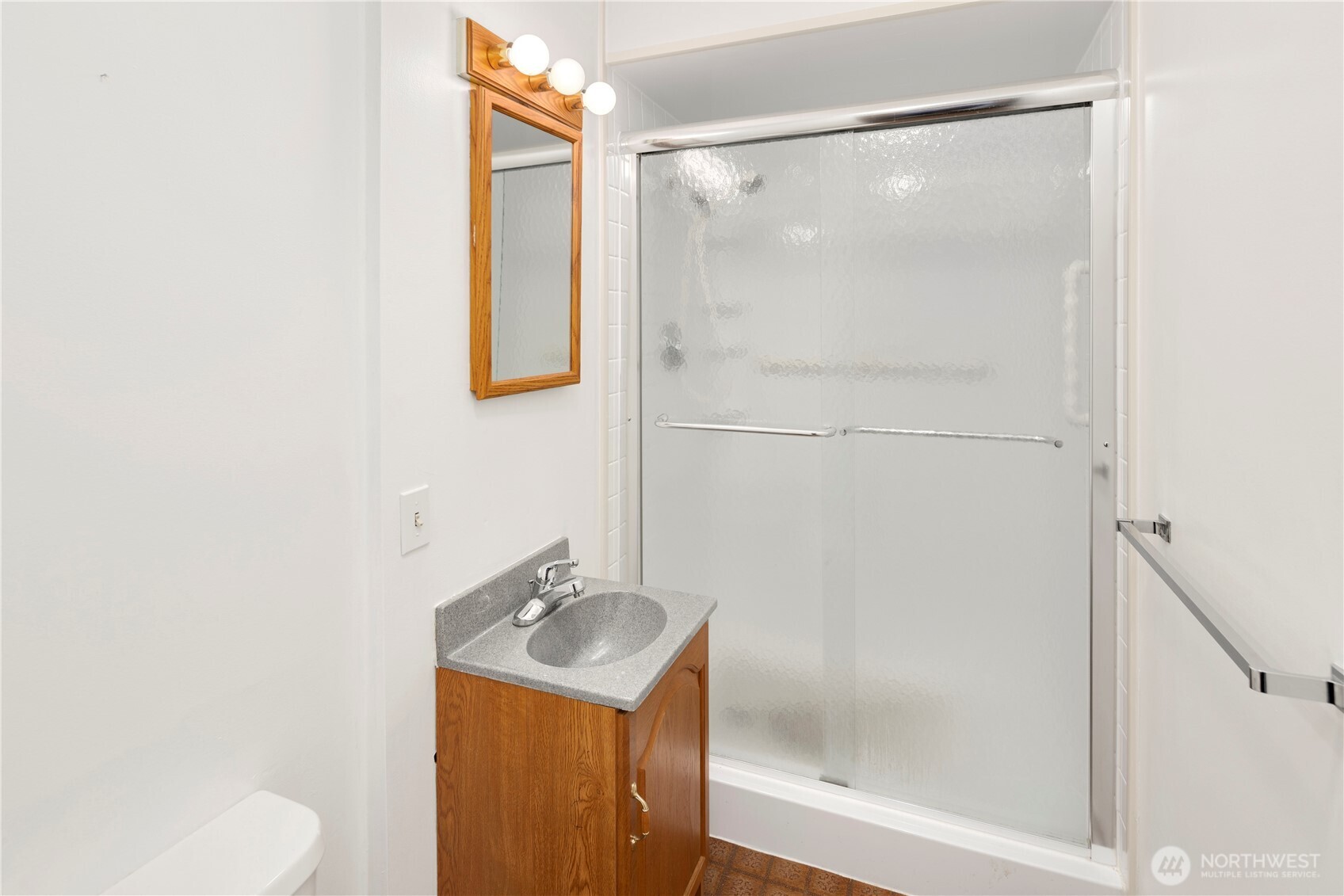 3653 West Commodore Way Seattle, WA 98199 - Photo 28 of 35 a bathroom with a sink toilet and shower