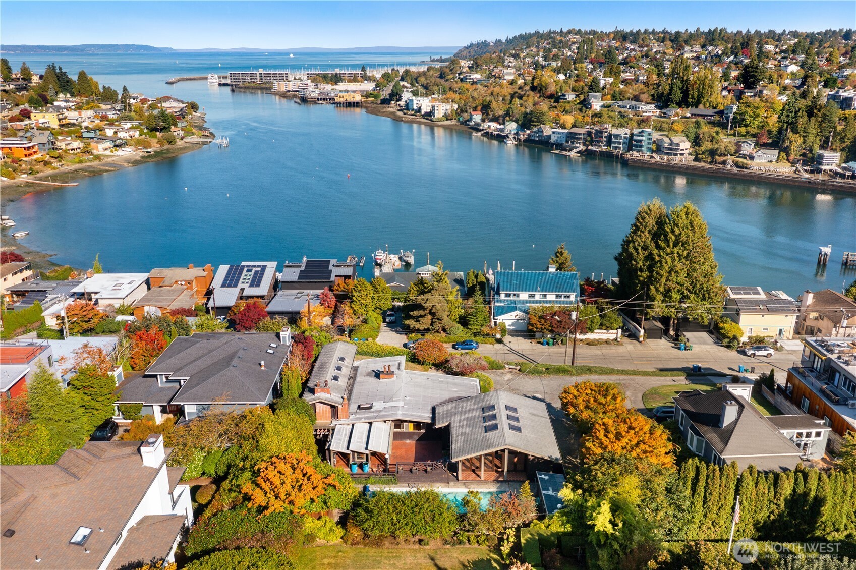 3653 West Commodore Way Seattle, WA 98199 - Photo 3 of 35 an aerial view of a house with a lake view