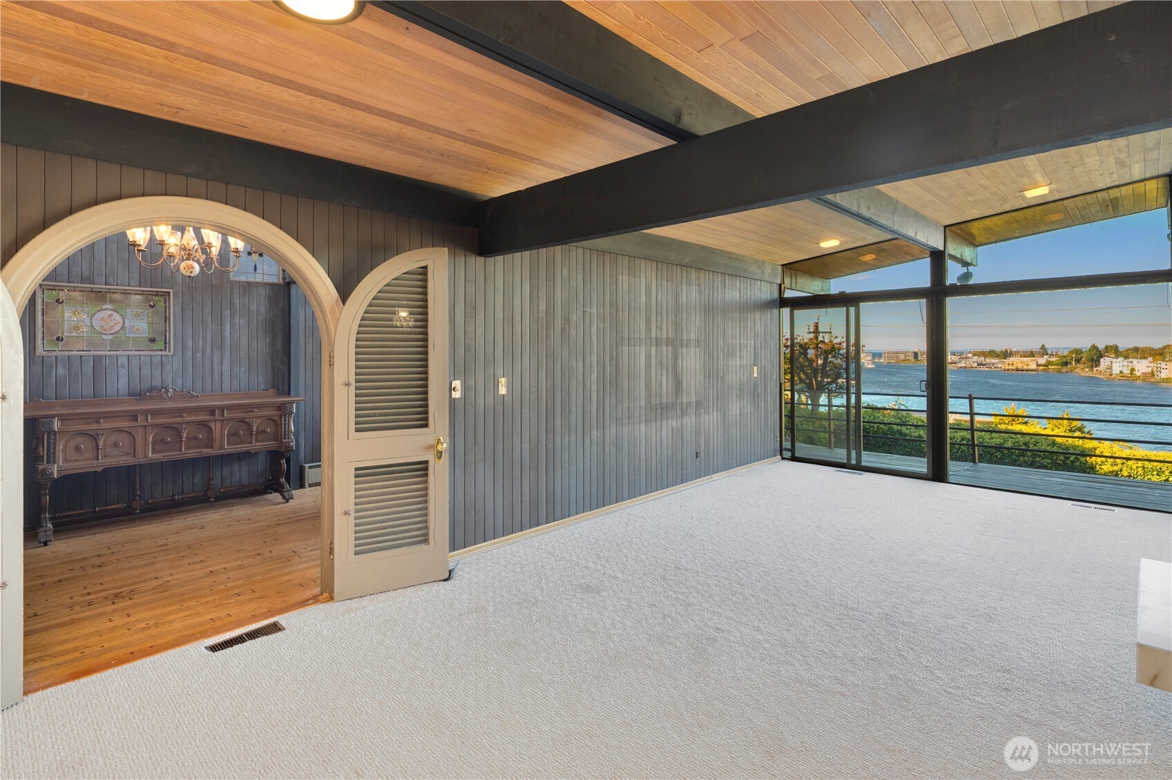 3653 West Commodore Way Seattle, WA 98199 - Photo 10 of 35 a view of an empty room with a fireplace and a large window