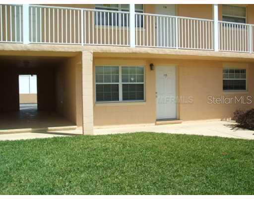 1400 Eudora Road, Unit F55 Mount Dora, FL 32757 - Photo 1 of 1 a view of a house with a yard and a large window
