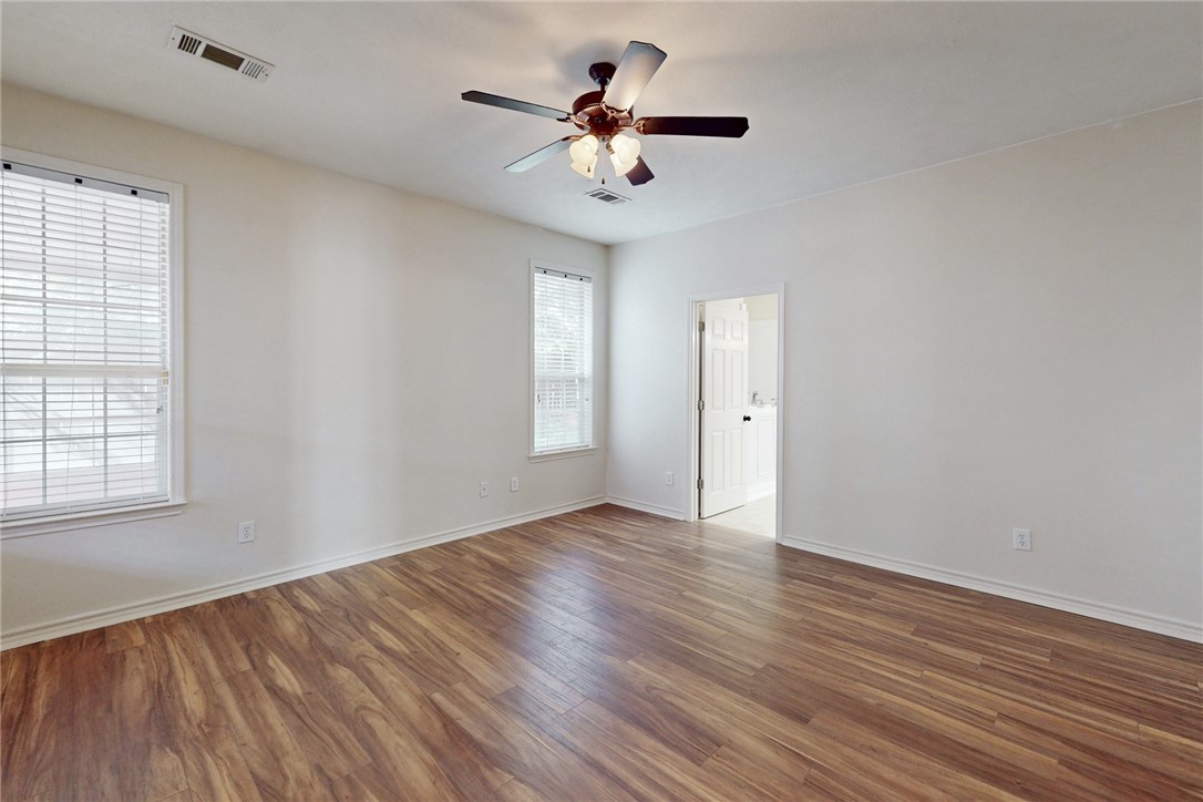 2619 Trophy Drive Bryan, TX 77802 - Photo 18 of 28 wooden floor in an empty room with a window