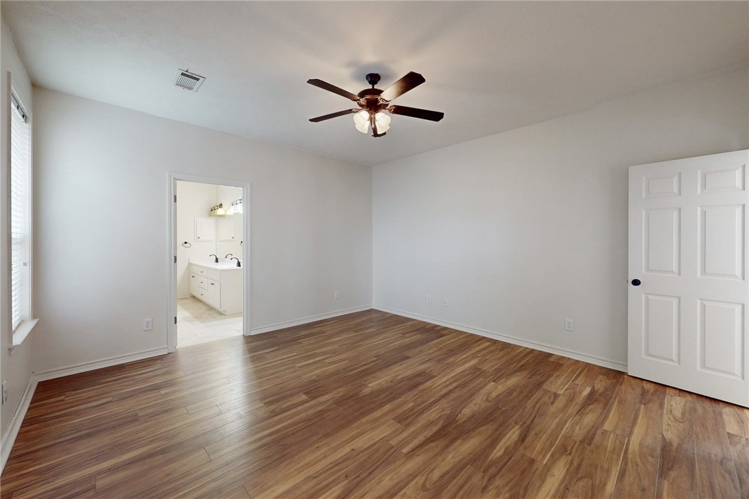 2619 Trophy Drive Bryan, TX 77802 - Photo 19 of 28 a view of an empty room with wooden floor