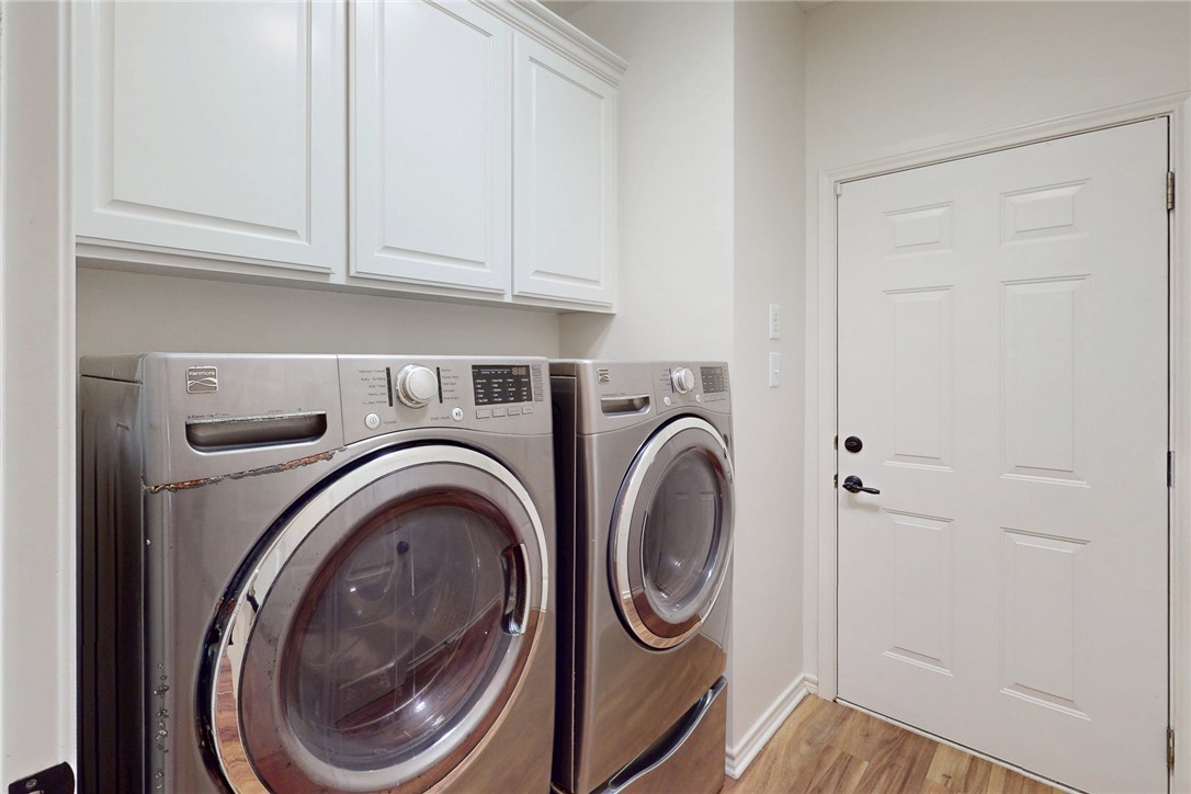 2619 Trophy Drive Bryan, TX 77802 - Photo 28 of 28 a utility room with dryer and washer