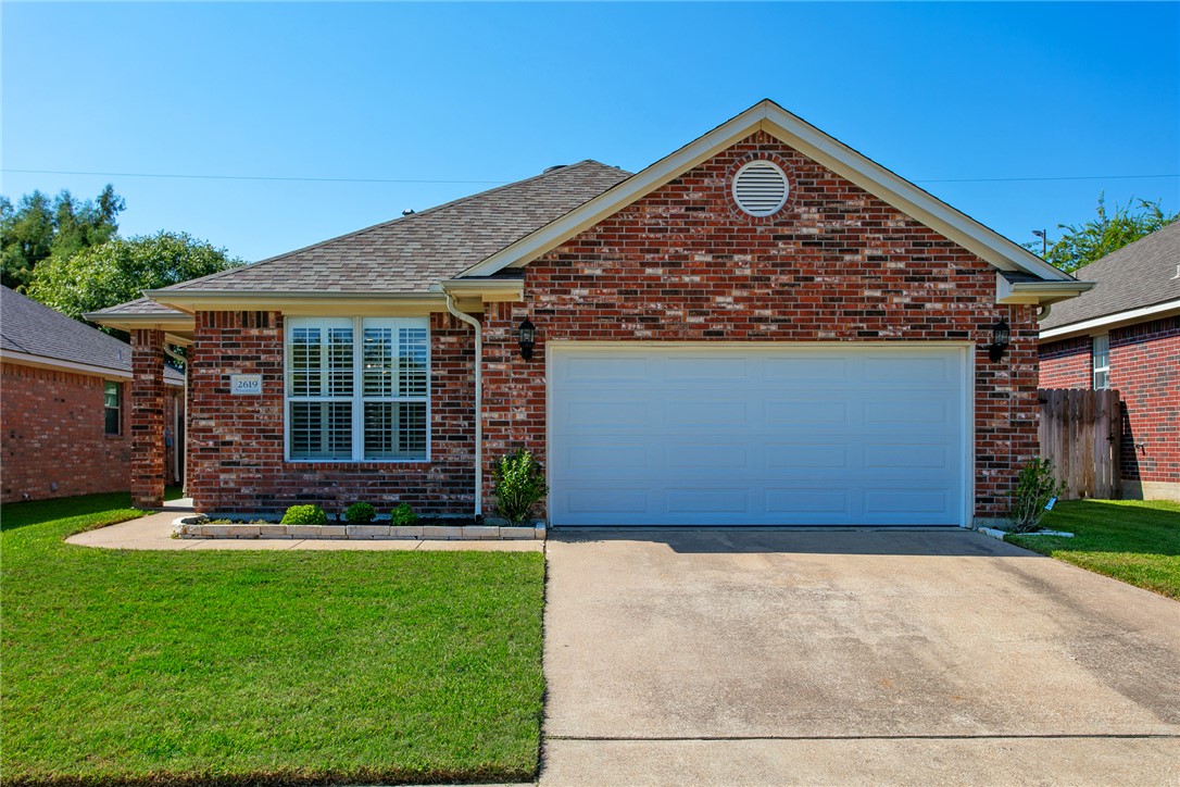 2619 Trophy Drive Bryan, TX 77802 - Photo 3 of 28 a front view of a house with garden
