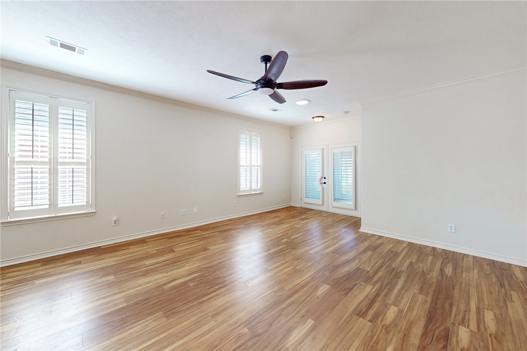 2619 Trophy Drive Bryan, TX 77802 - Photo 10 of 28 wooden floor in an empty room with a window