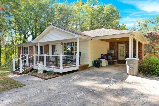 a view of a house with a yard and balcony