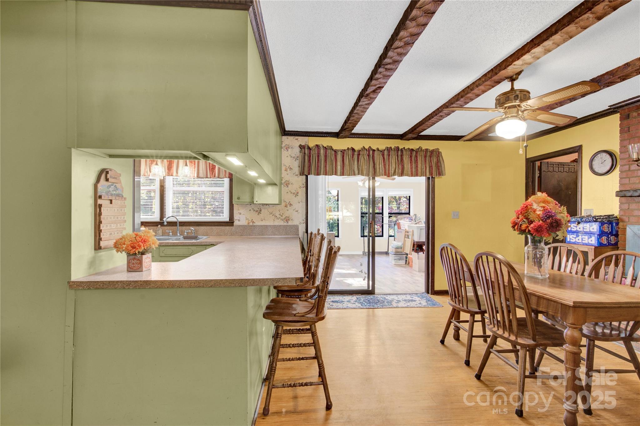 841 Knowles Drive Dallas, NC 28034 - Photo 11 of 46 a dining room with furniture and a chandelier