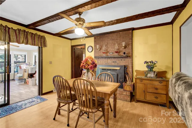 a dining room with furniture and window