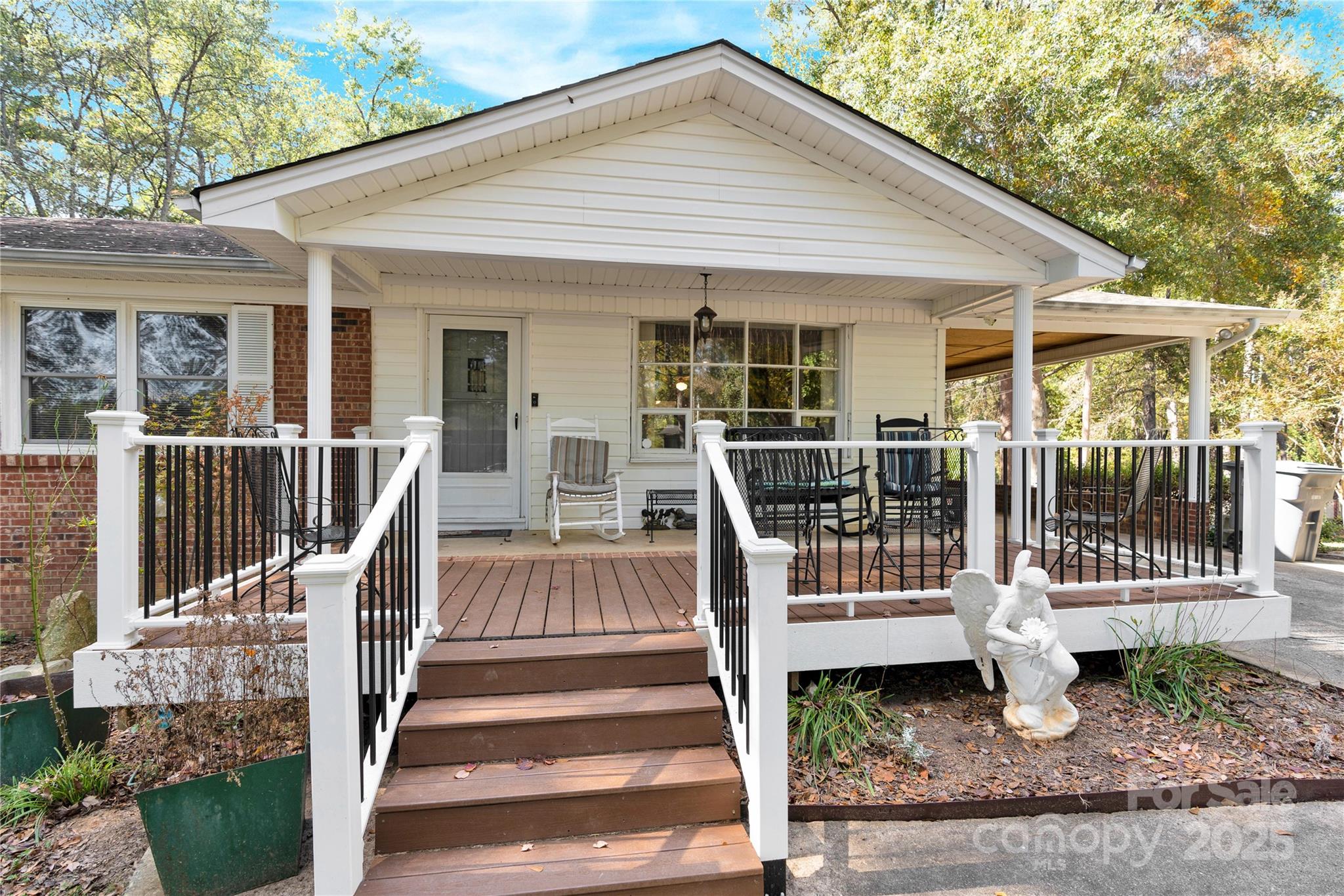 841 Knowles Drive Dallas, NC 28034 - Photo 2 of 46 a view of a house with wooden deck and floor