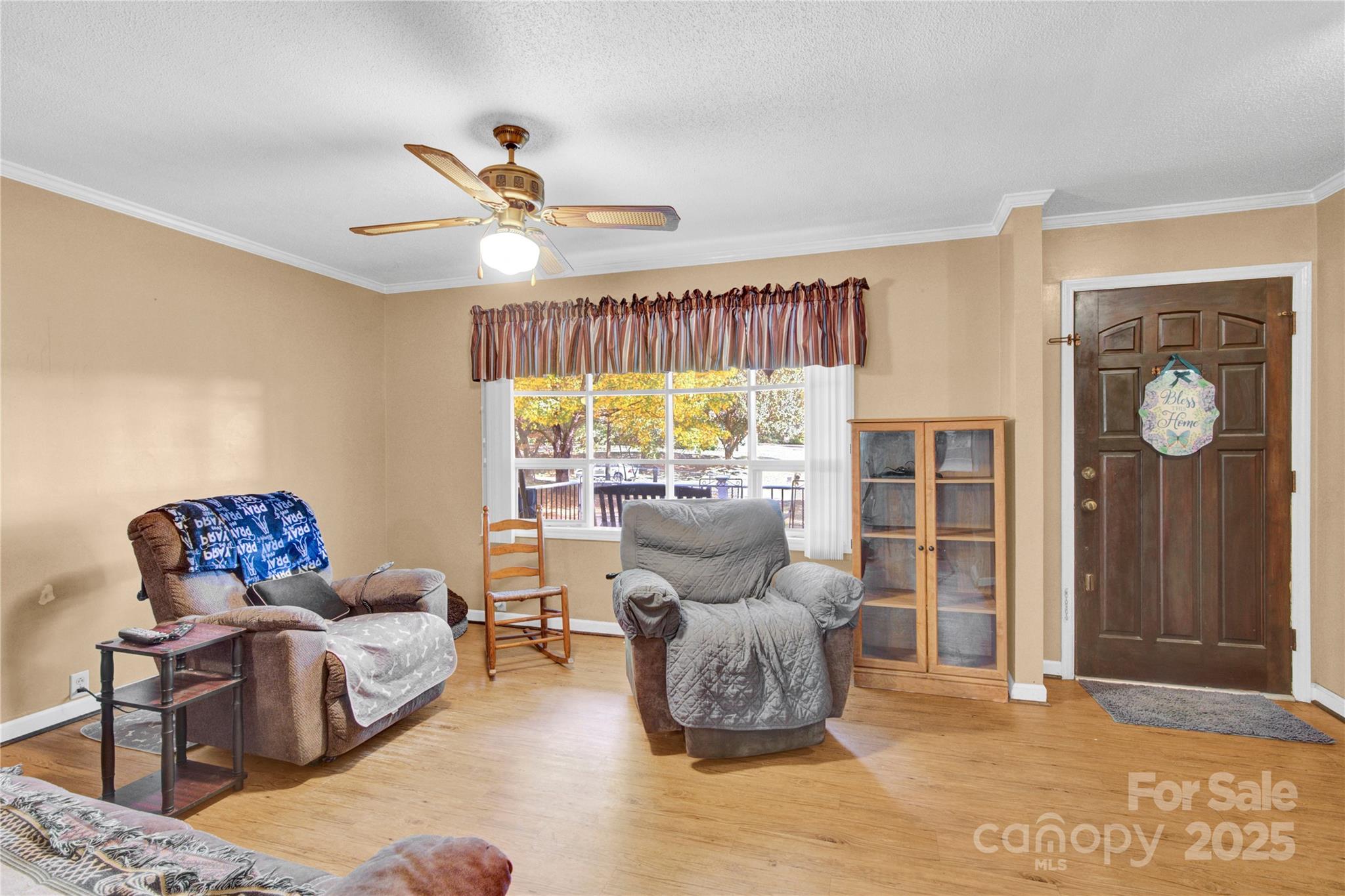 841 Knowles Drive Dallas, NC 28034 - Photo 25 of 46 a living room with furniture and a large window