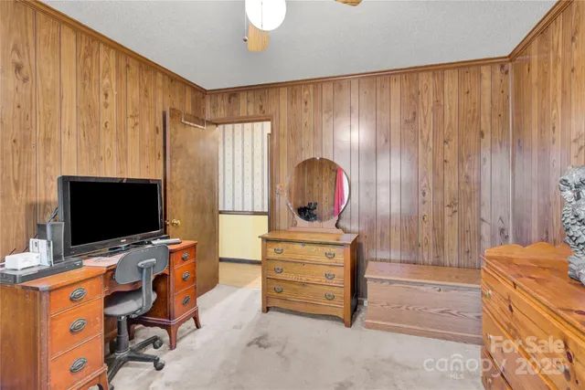 a room with furniture and flat screen tv