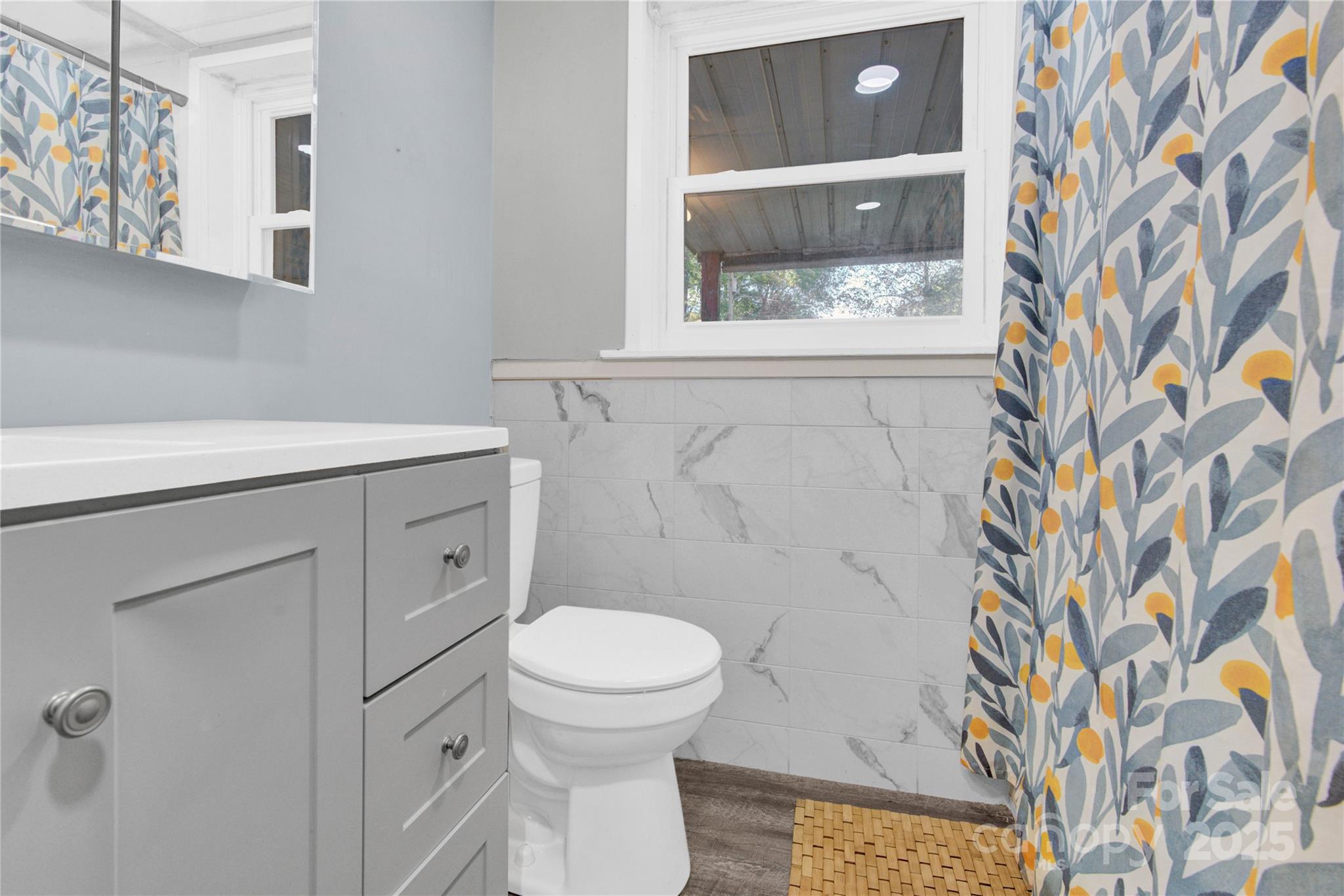 841 Knowles Drive Dallas, NC 28034 - Photo 32 of 46 a bathroom with a granite countertop toilet and a sink