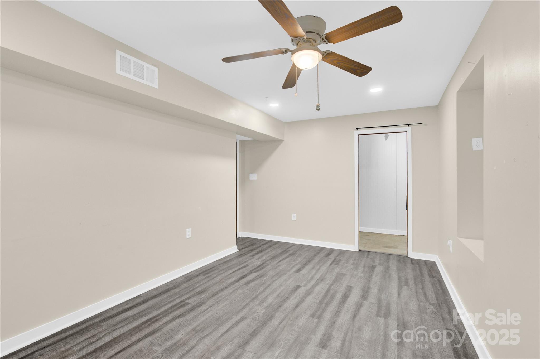 841 Knowles Drive Dallas, NC 28034 - Photo 34 of 46 a view of an empty room with wooden floor